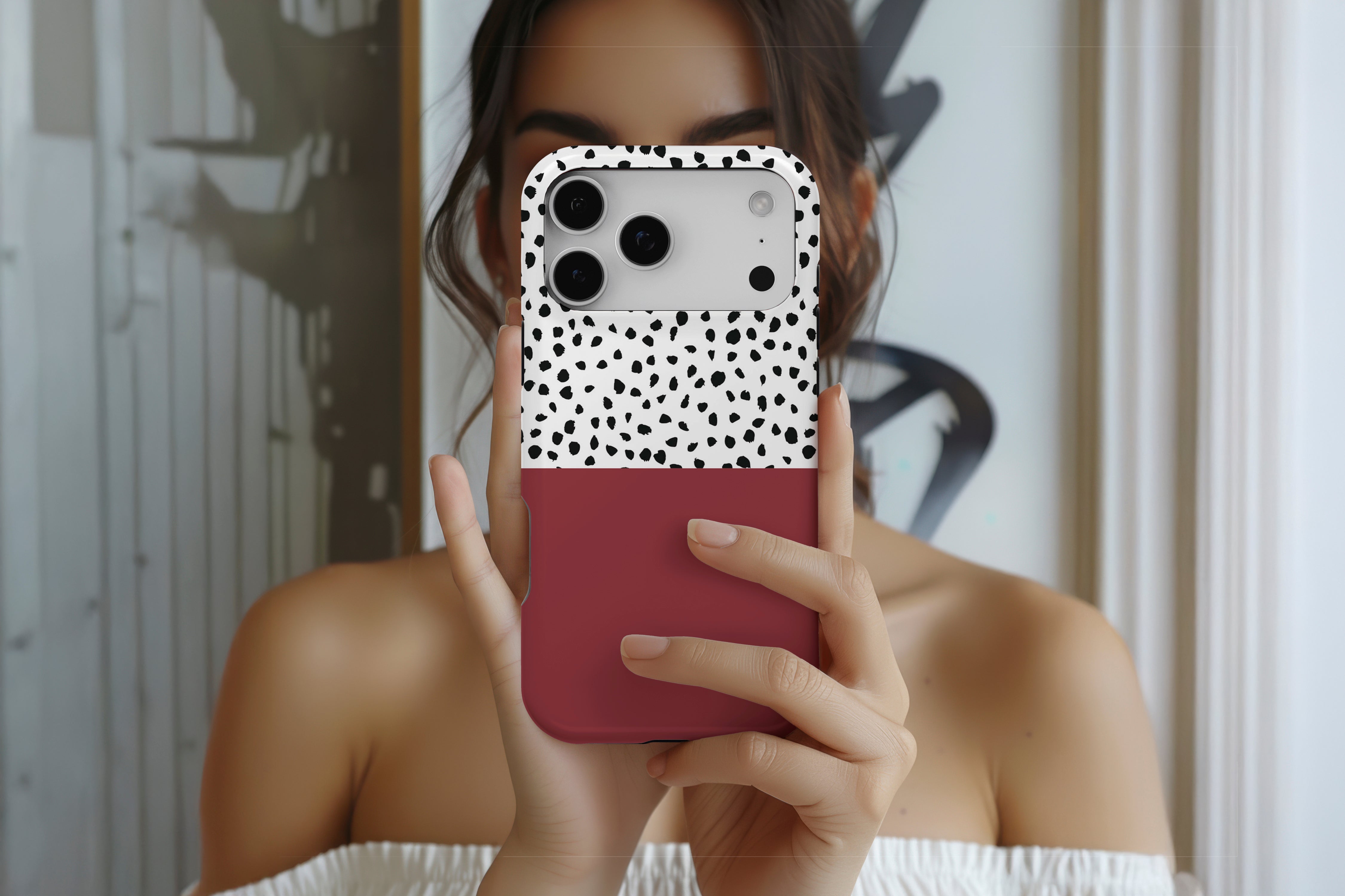 Lifestyle image of Geometric Dots Burgundy magnetic tough case showing burgundy dotty design