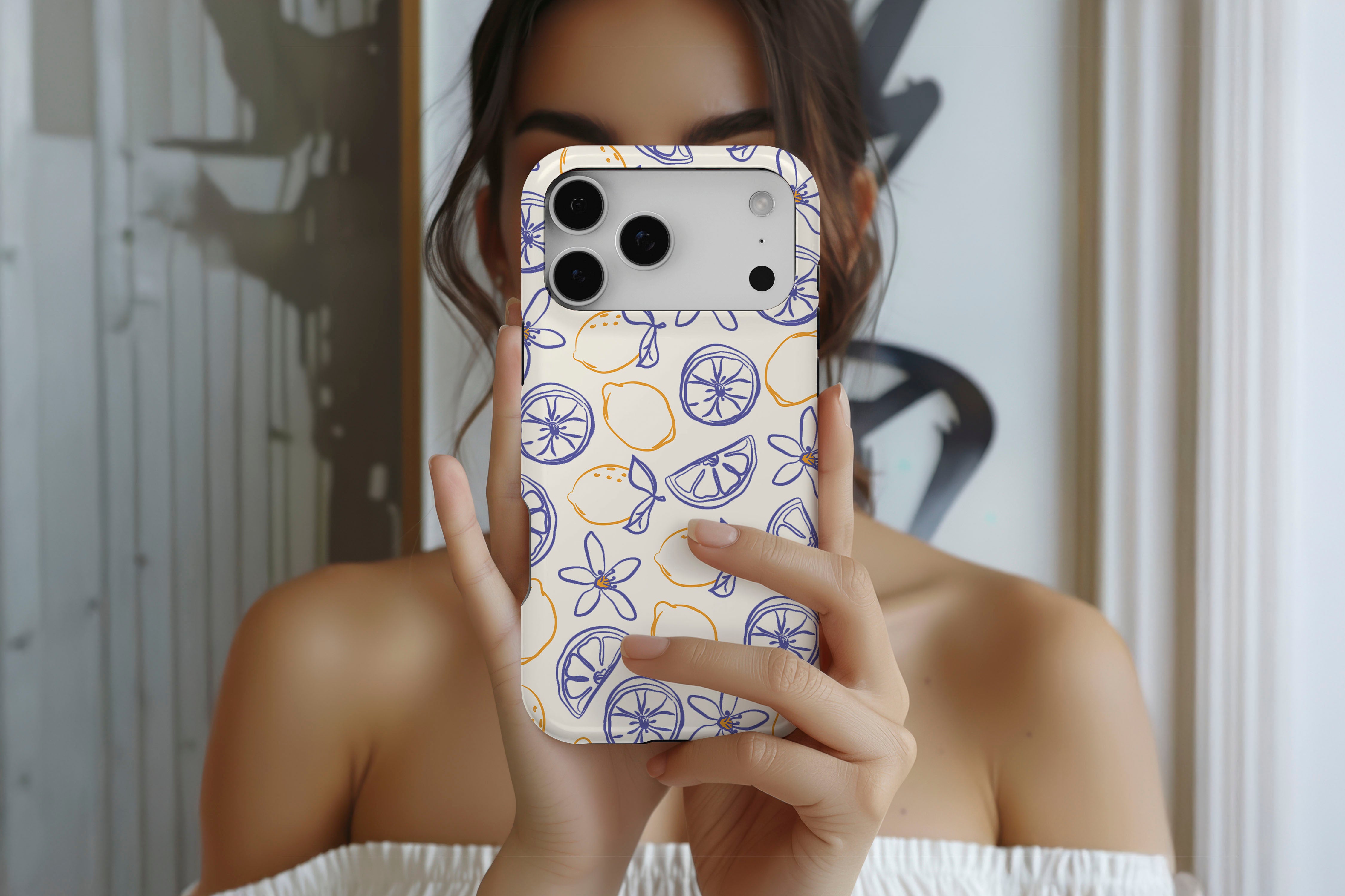 Lifestyle image of Amalfi Lemon magnetic tough case showing lemon print design