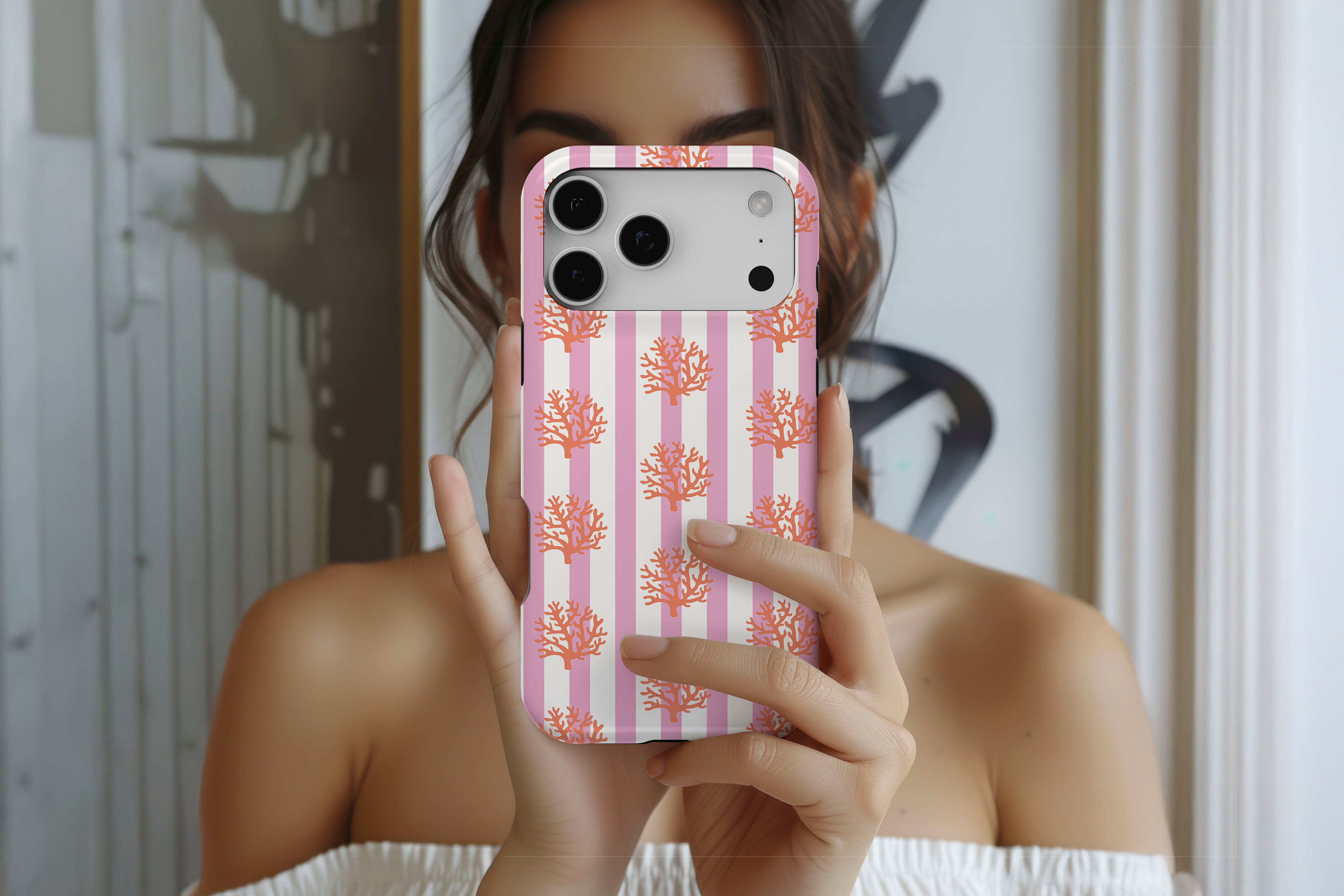 Lifestyle image of Coral magnetic tough case showing corals print design