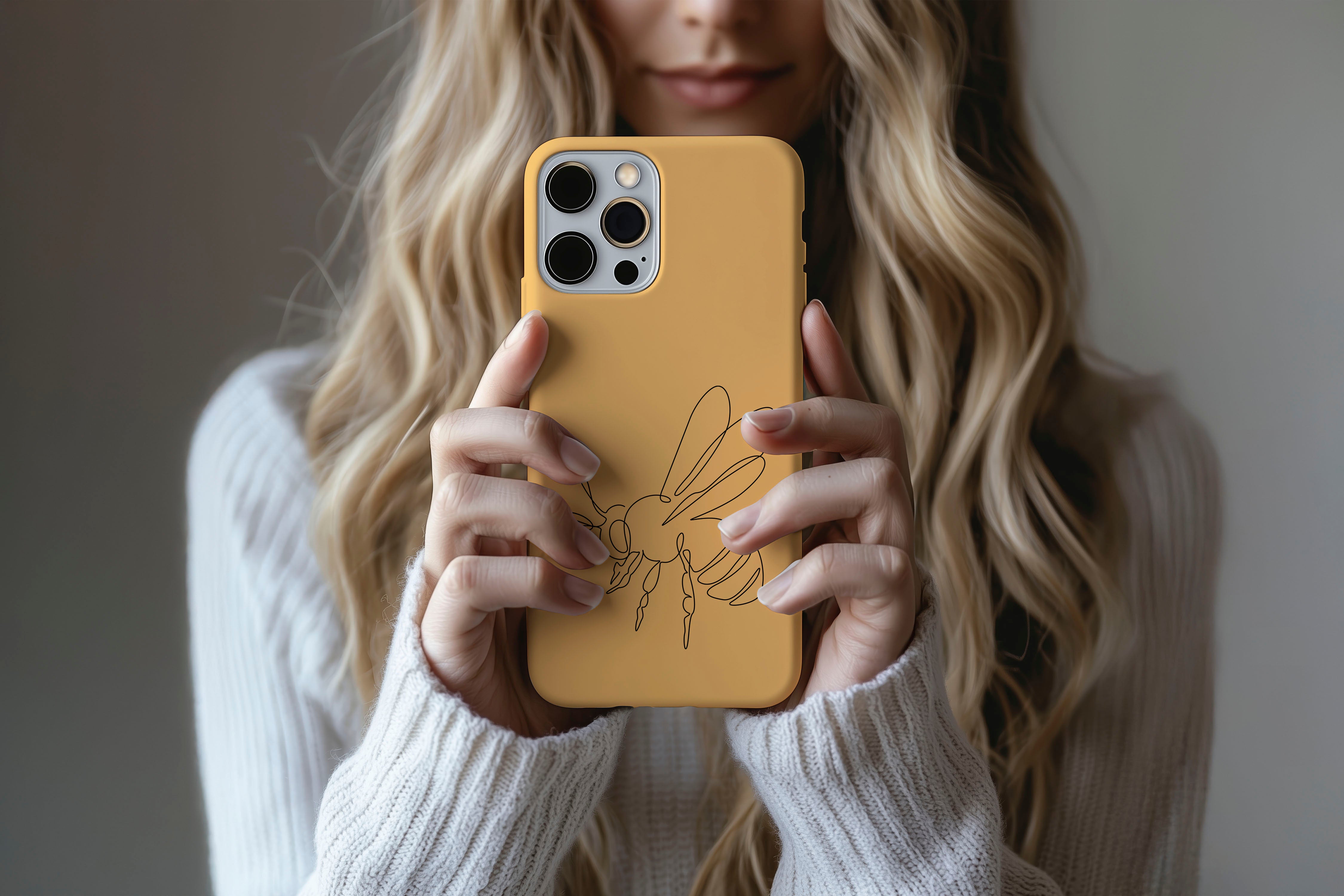 Lifestyle image of Doodle Bee phone case showing minimalist bee print design