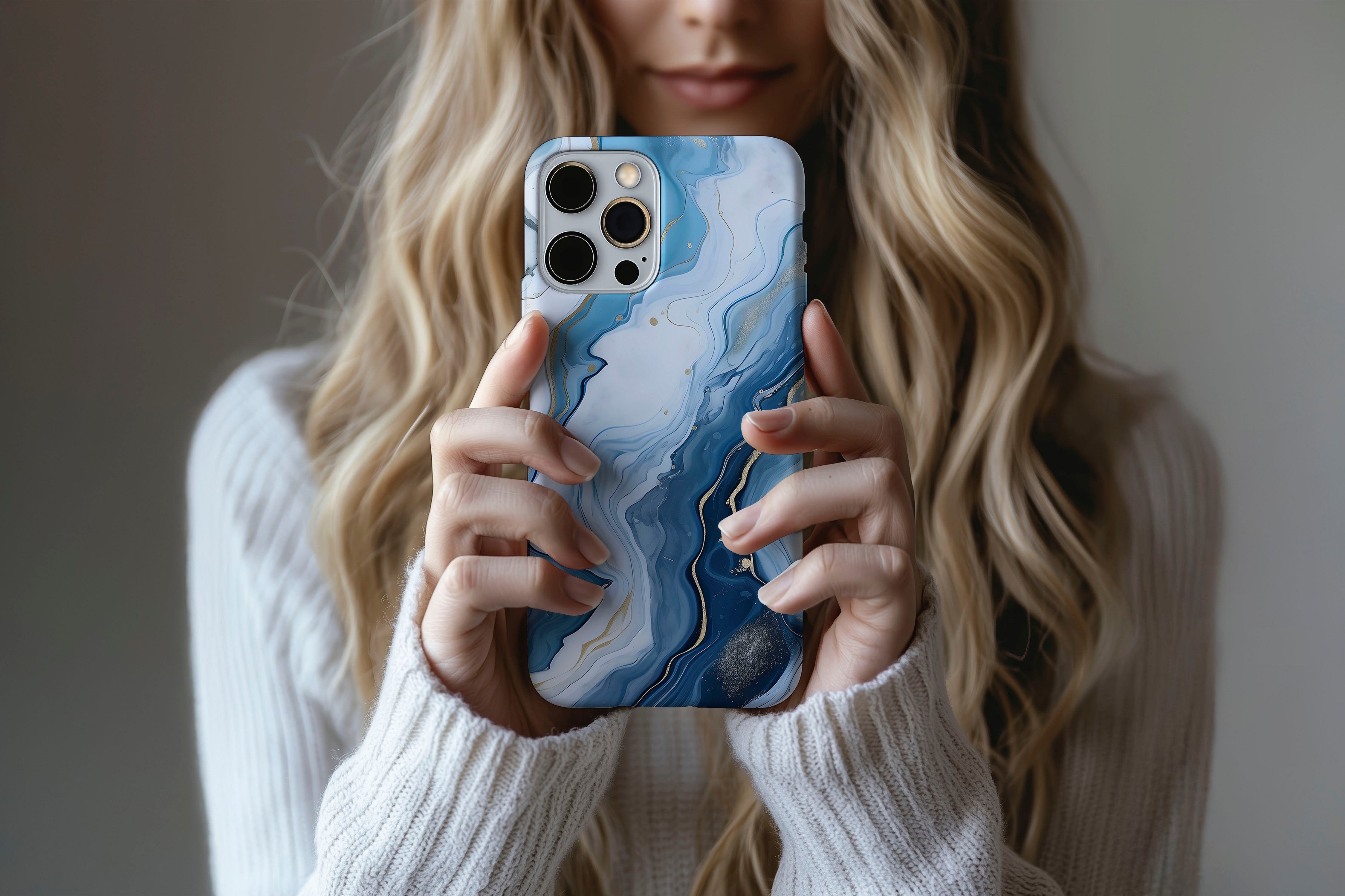 Lifestyle image of Opulent Blue phone case showing marble print design