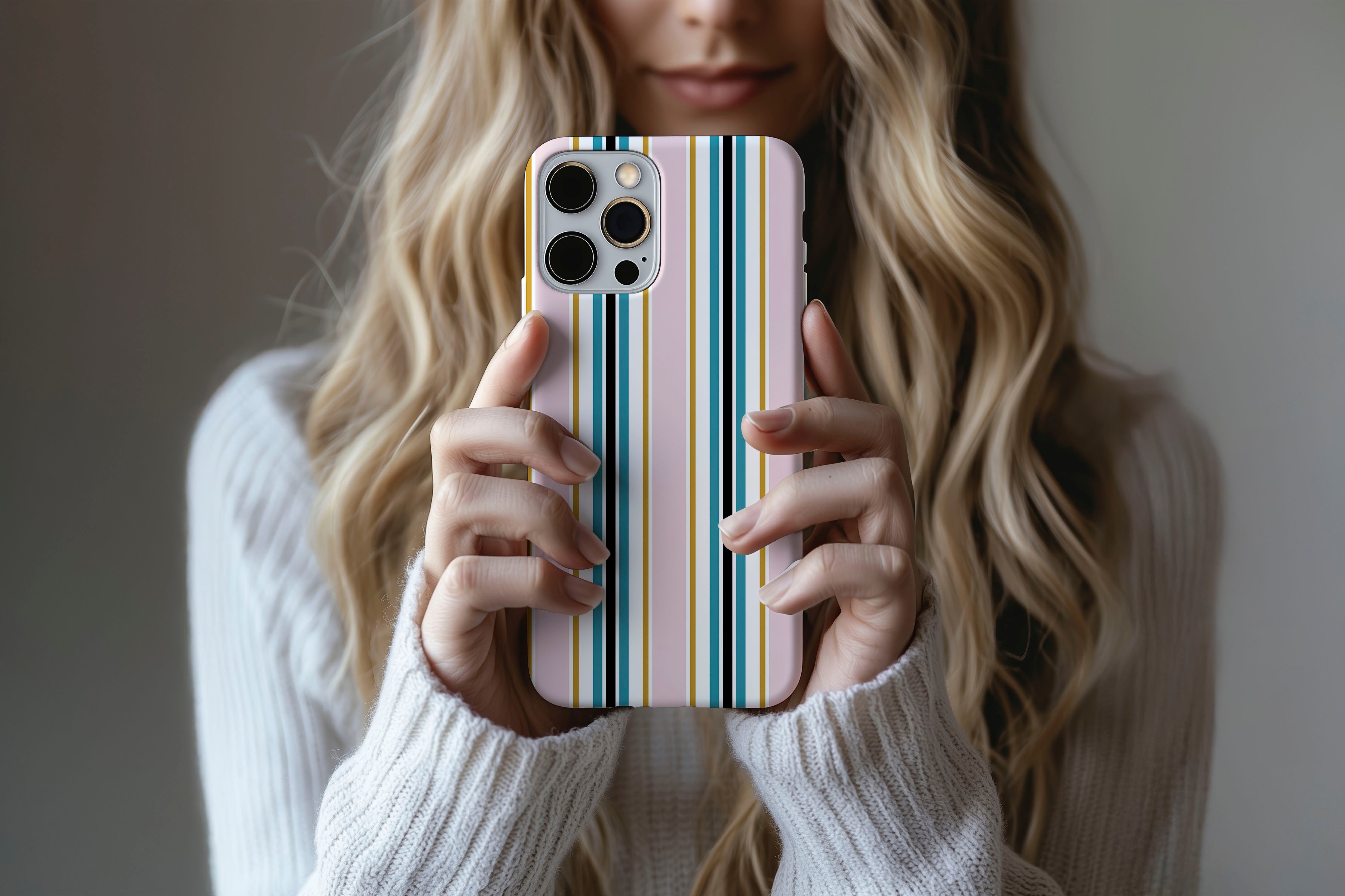 Lifestyle image of Palm Springs phone case showing multi stripe print design