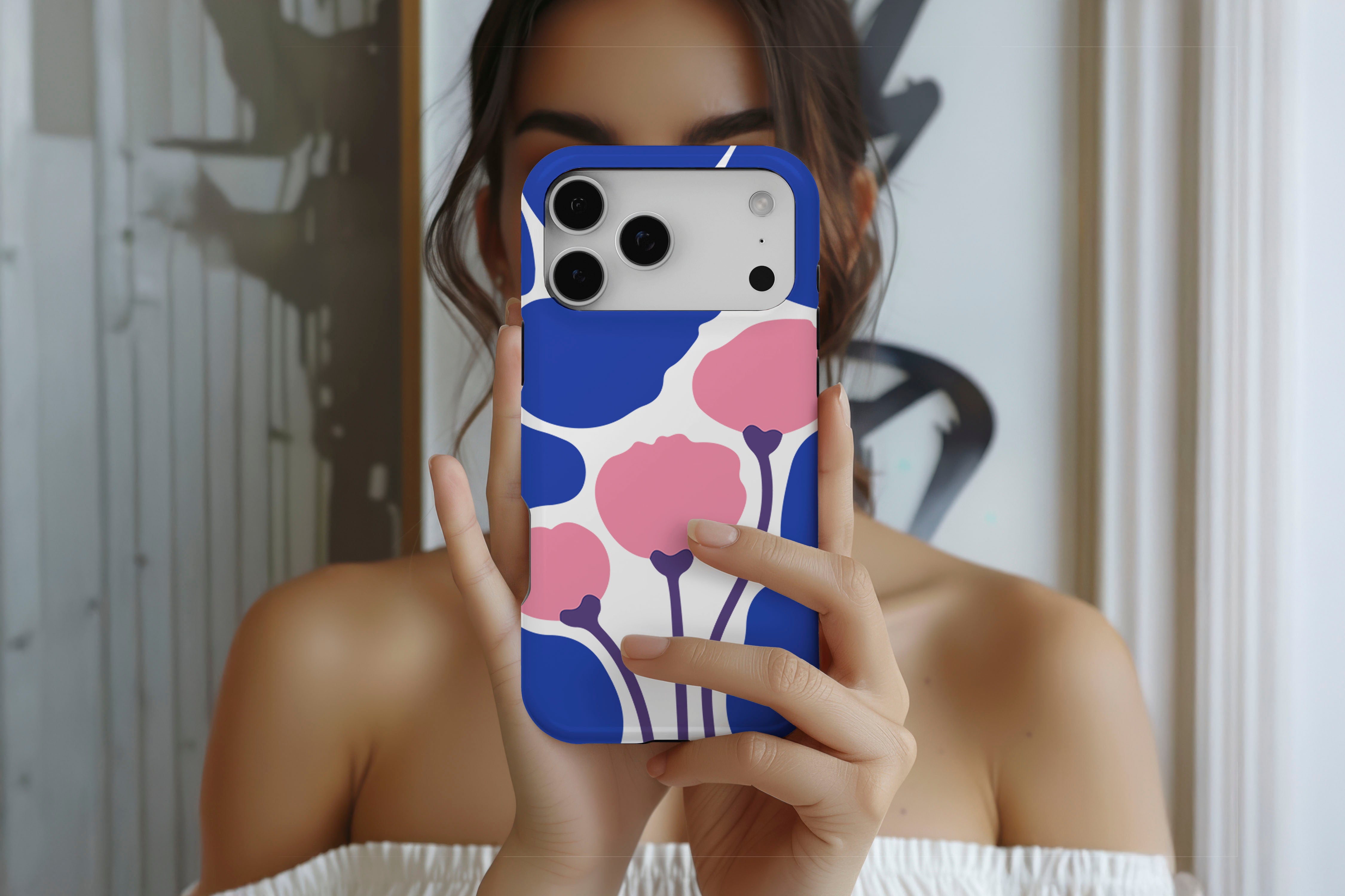Lifestyle image of Poppy Art magnetic tough case showing floral print design