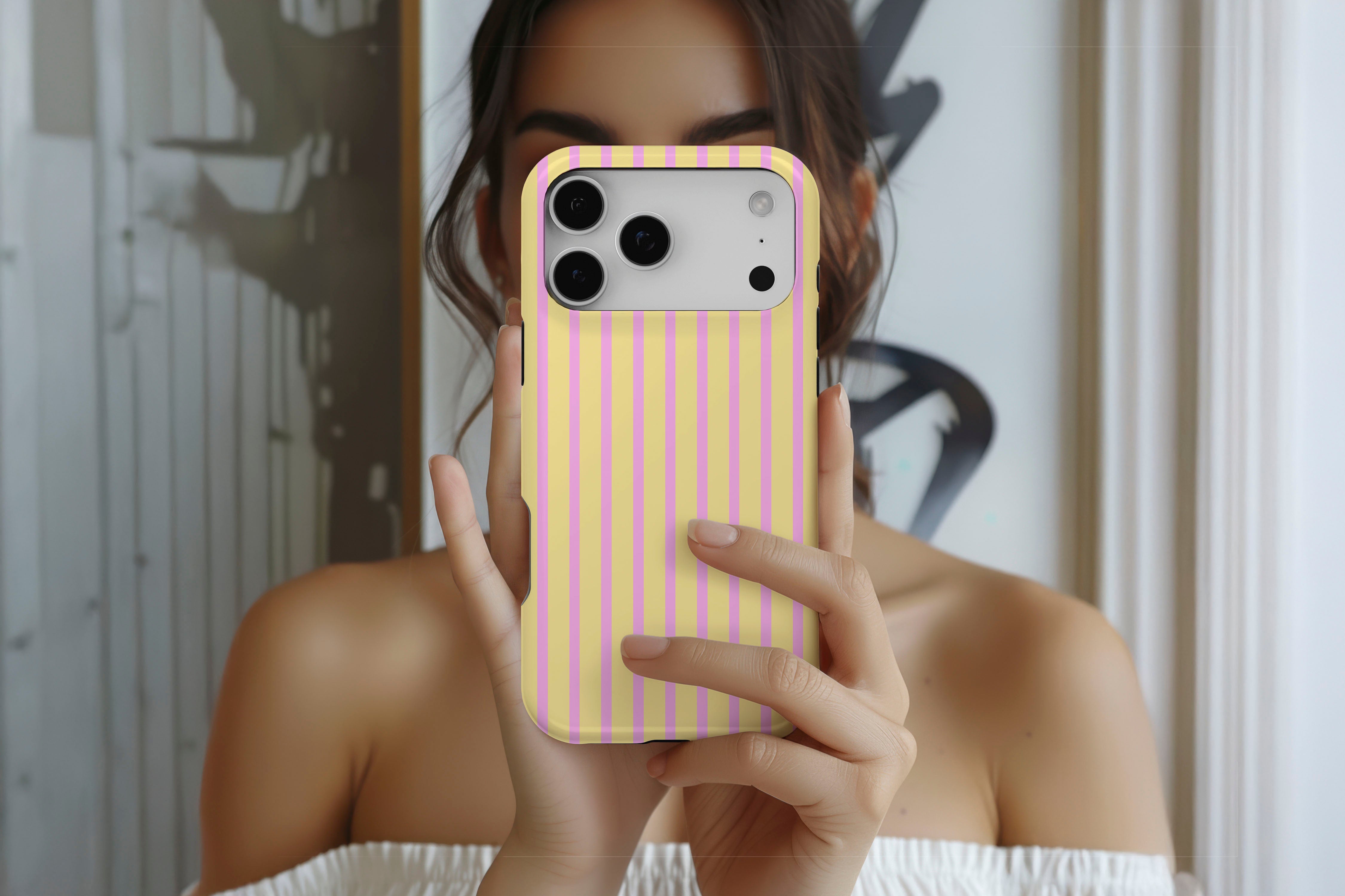 Lifestyle image of Stripes (Lemonade) magnetic tough case showing stripe print design
