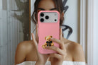 Lifestyle image of Teddy Bear Pink magnetic tough case showing bear design on pink background 