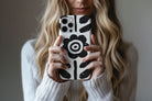 Lifestyle image of Abstract Flower phone case showing mono flower design 