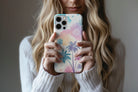 Lifestyle image of Abstract Palm phone case showing multi colour palm print design