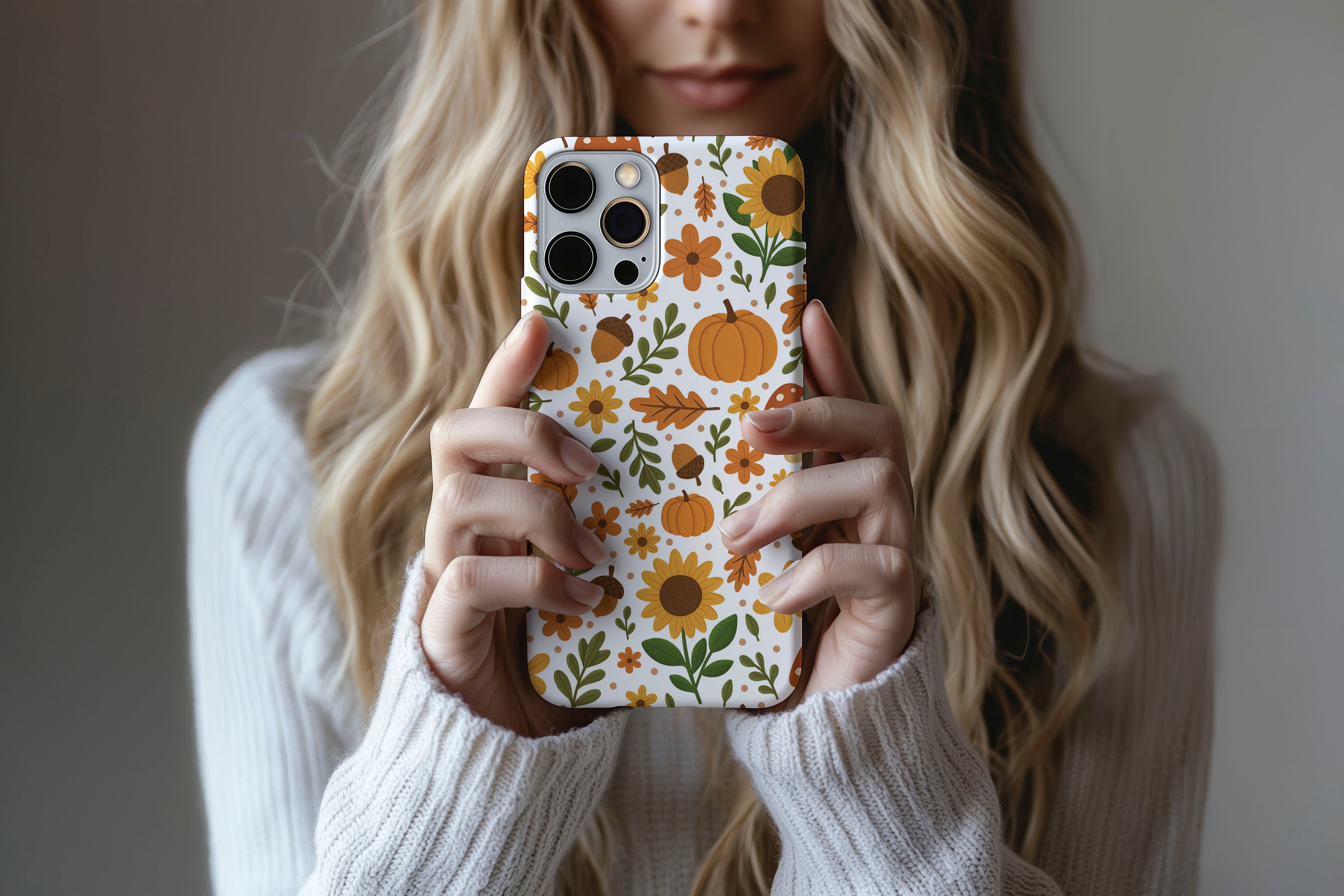 Lifestyle image of Autumn Meadow phone case showing autumn floral print design