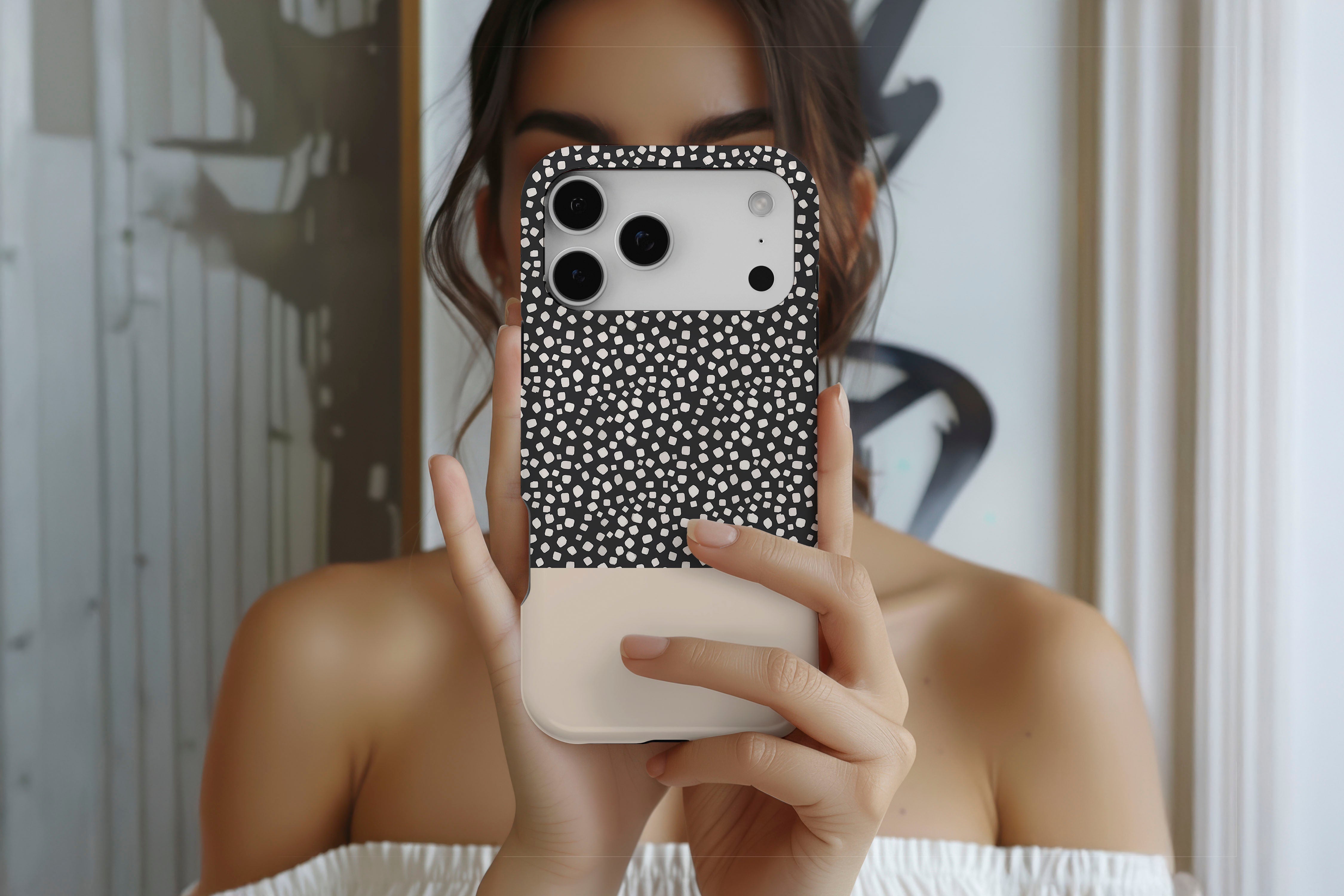 Lifestyle image of Black Spot magnetic tough case showing geometric design 