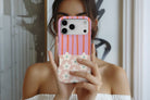Lifestyle image of Cabana Bloom magnetic tough case showing striped floral print design