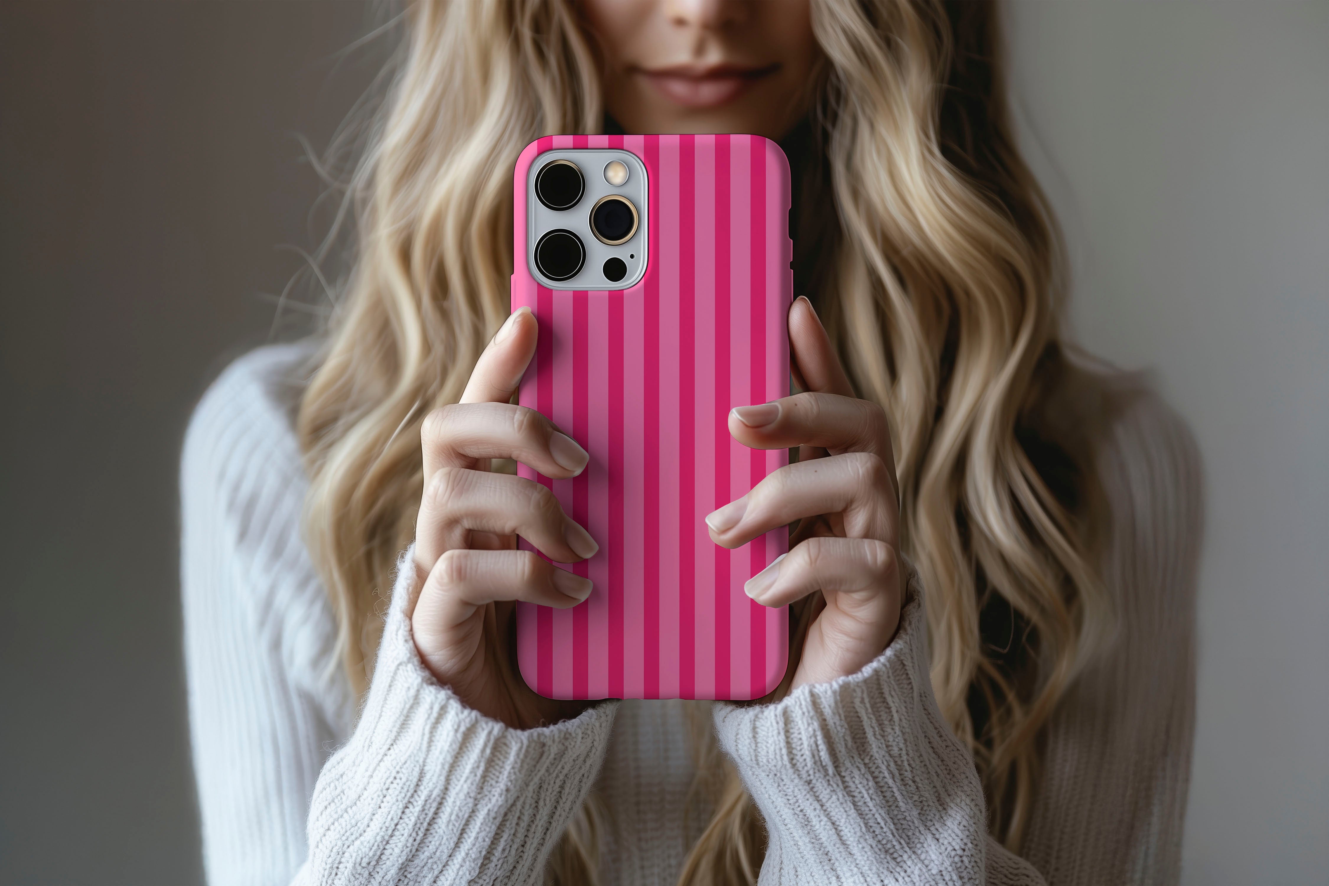 Lifestyle image of Candy Stripe phone case showing  pink stripe design 