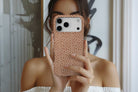 Lifestyle image of Caramel Dots magnetic tough case showing dotty design