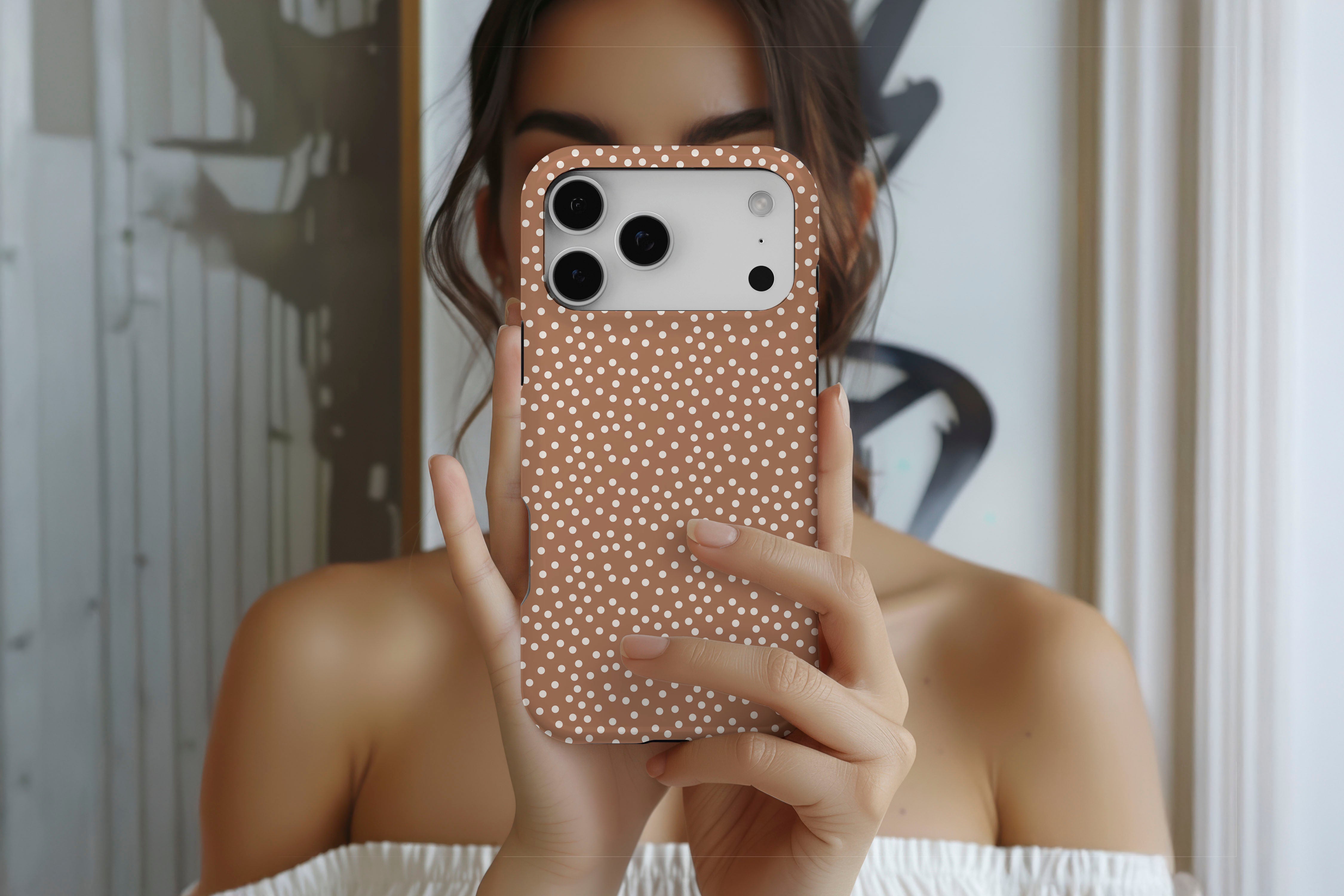 Lifestyle image of Caramel Dots magnetic tough case showing dotty design