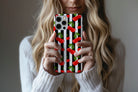 Lifestyle image of Cherry Crush phone case showing cherry print design