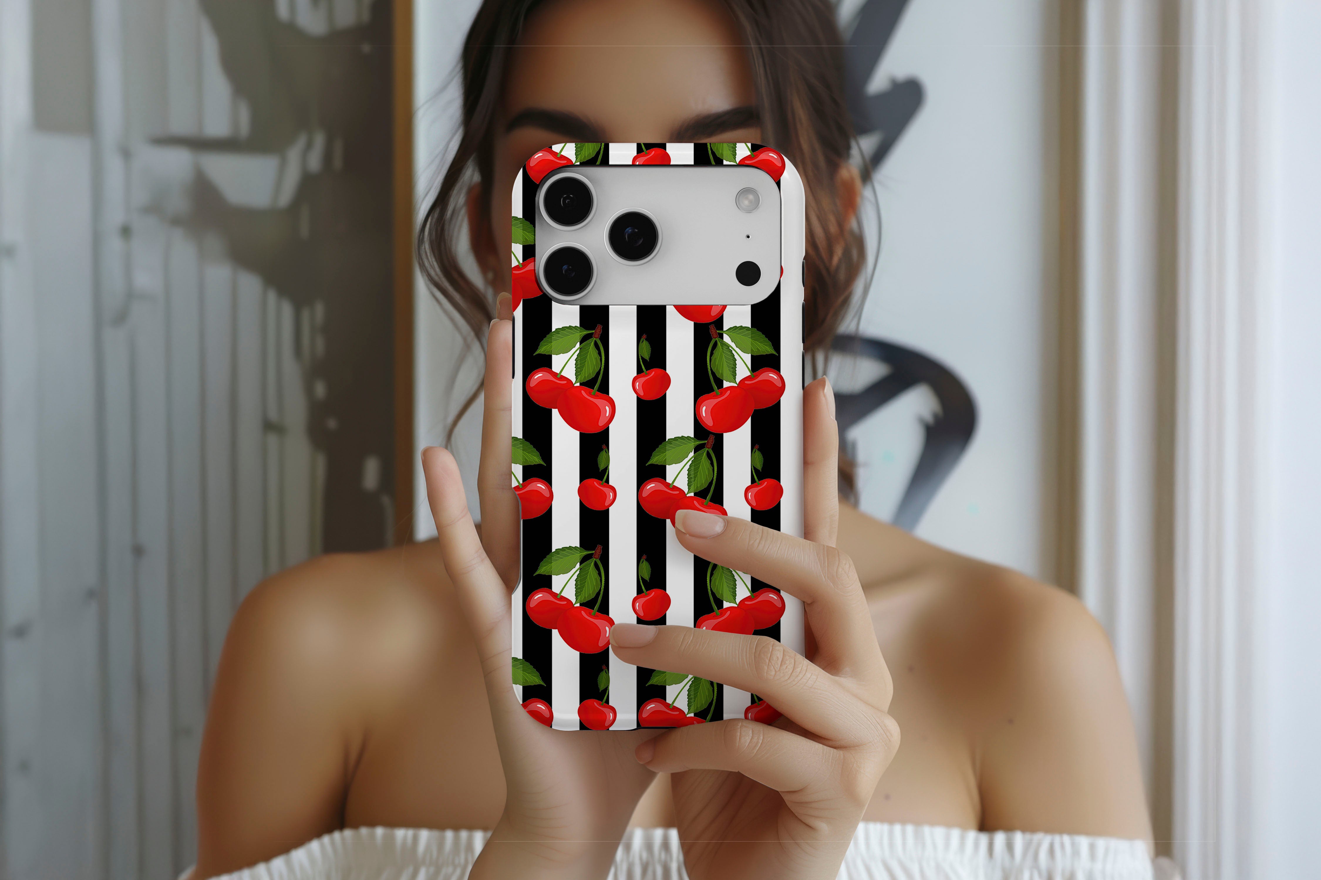 Lifestyle image of Cherry Crush magnetic tough case showing cherry print design