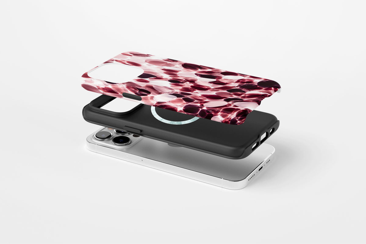 Side view of Confetti (Berry) phone case showing berry, blush pink and cream confetti glass print