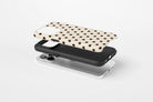 Cream Spot Tough phone case showing protective case profile