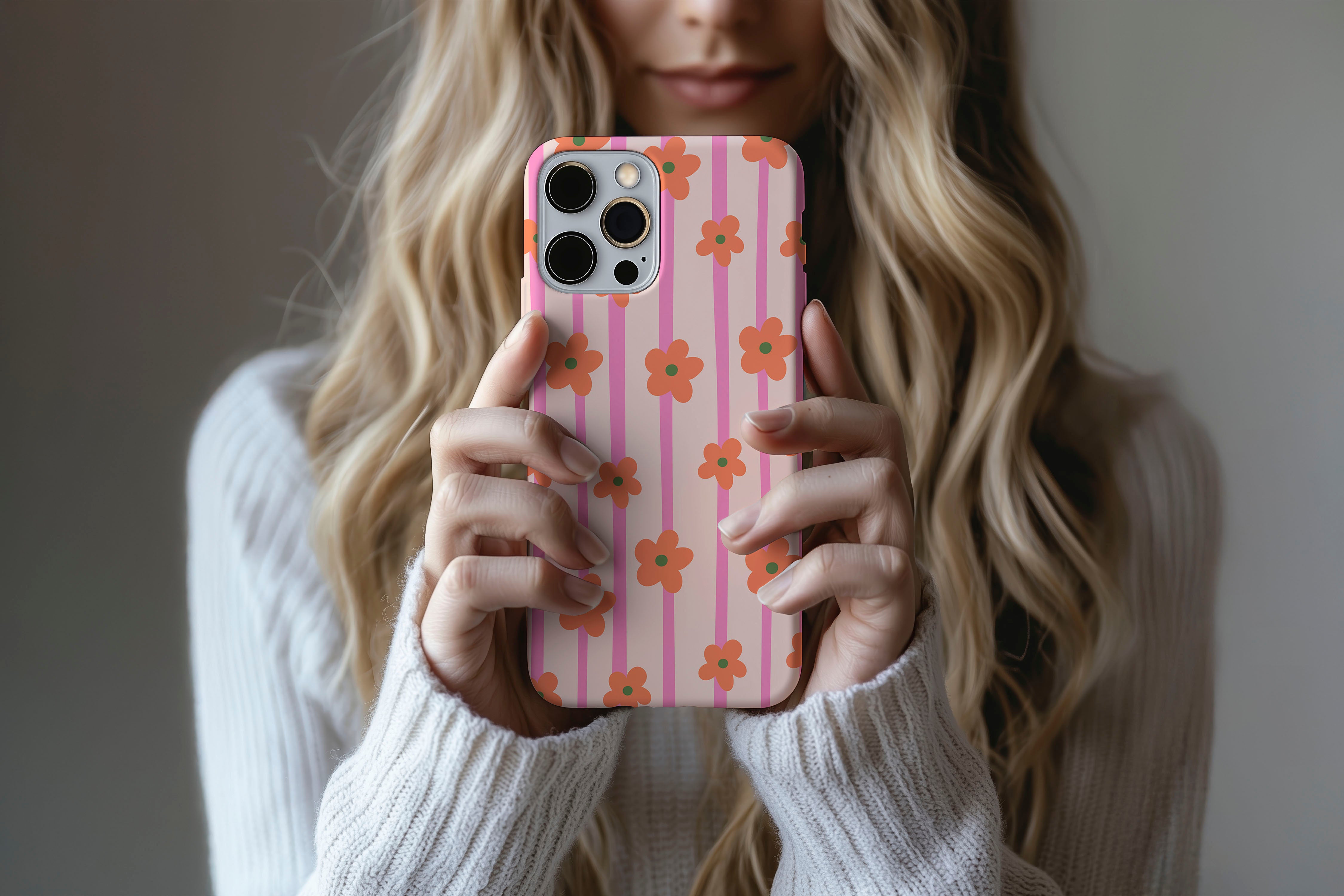 Lifestyle image of Daisy Chain phone case showing daisy stripe print design