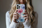 Lifestyle image of Dandelion dream phone case showing  floral design 