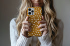 Lifestyle image of Freckled phone case showing freckled spot print design
