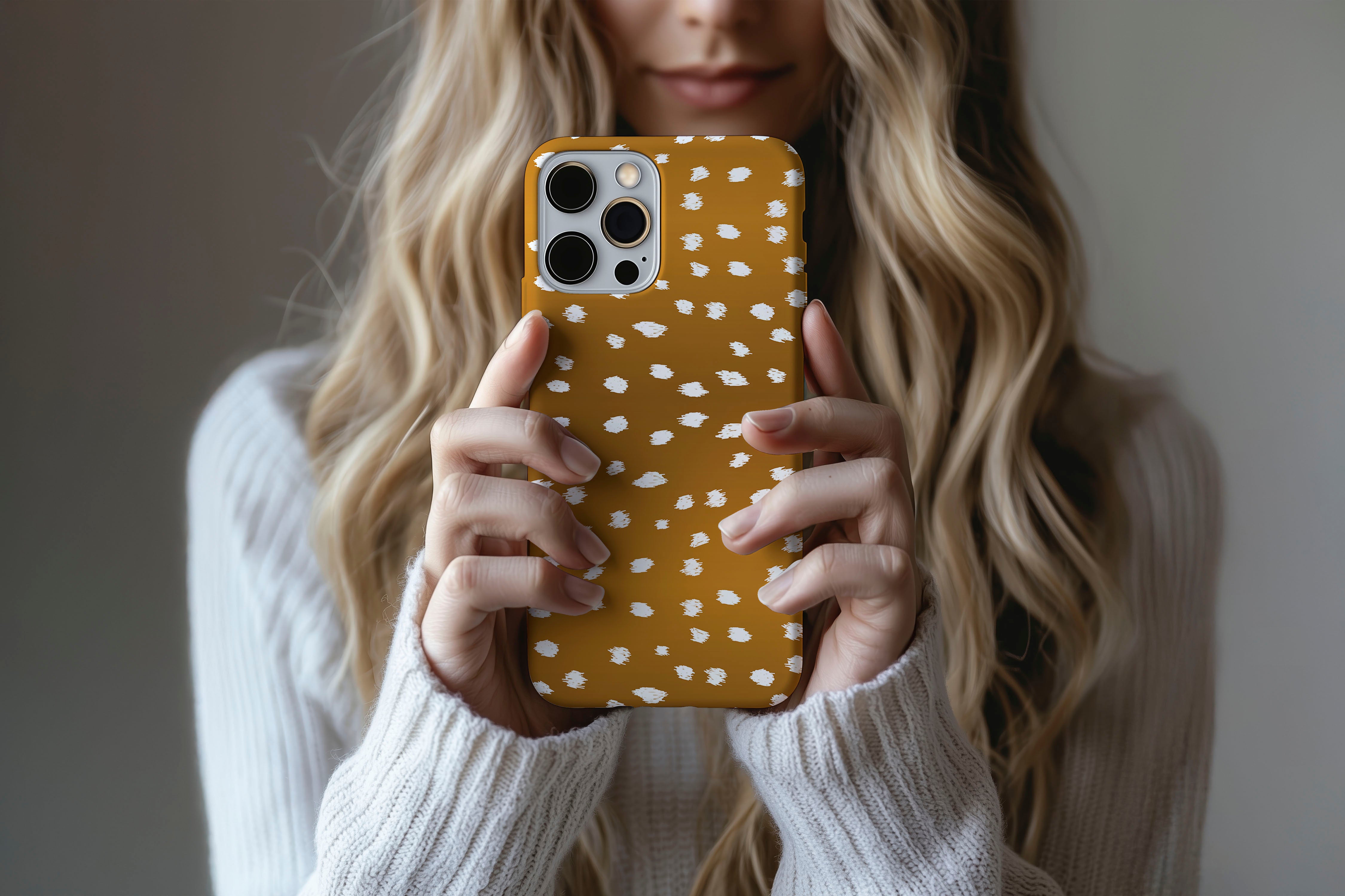 Lifestyle image of Freckled phone case showing freckled spot print design