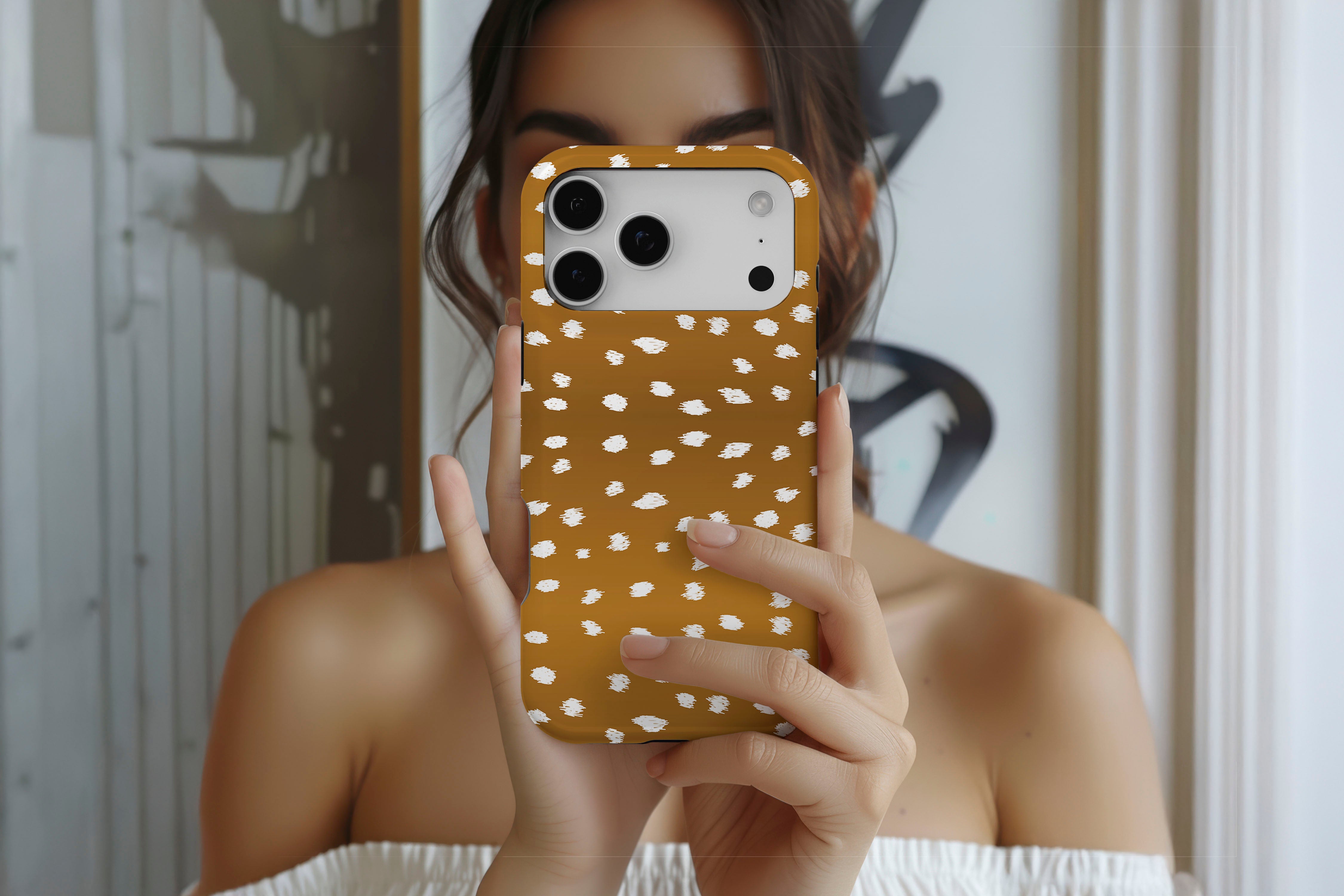 Lifestyle image of Freckled magnetic tough case showing freckled spot print design