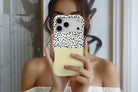 Lifestyle image of Geo Dots (Butter Yellow) magnetic tough case showing geometric dots print design