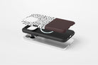 Side view of Geo Dots (Espresso) phone case showing black and white irregular dot print with espresso brown colour block