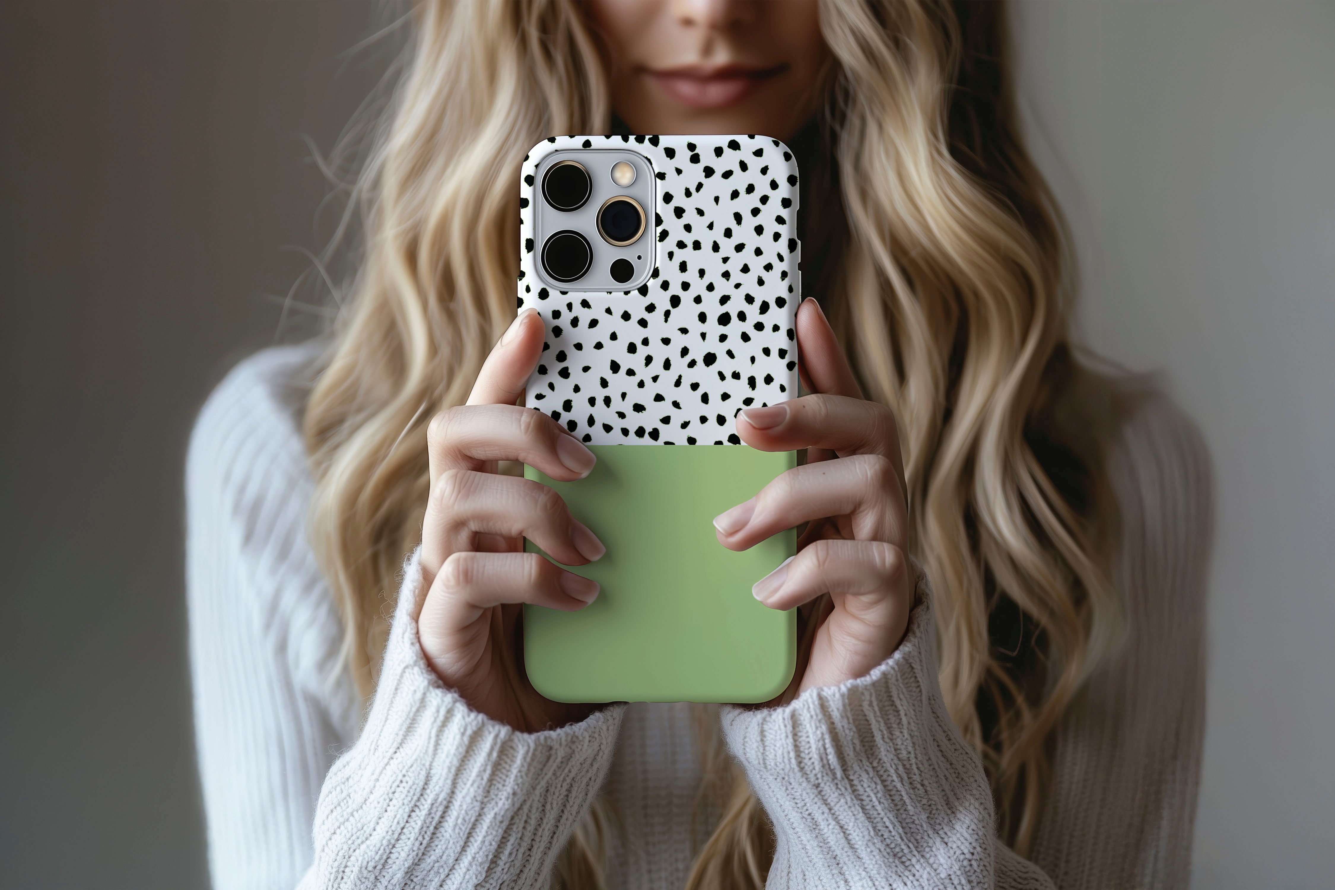 Lifestyle image of Geo Dots (Matcha) phone case showing geometric dots print design