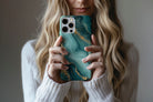 Lifestyle image of Green Marble phone case showing marble print design