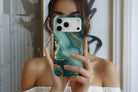 Lifestyle image of Green Marble magnetic tough case showing marble print design
