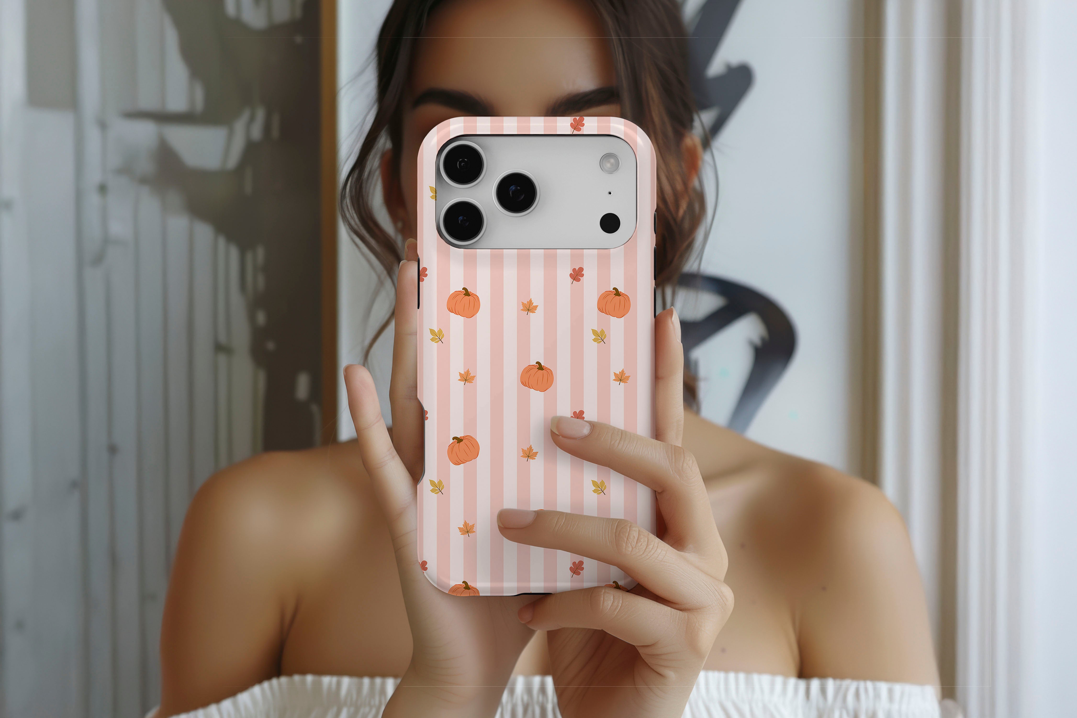 Lifestyle image of Hey There Pumpkin magnetic tough case showing pumpkin stripe print design