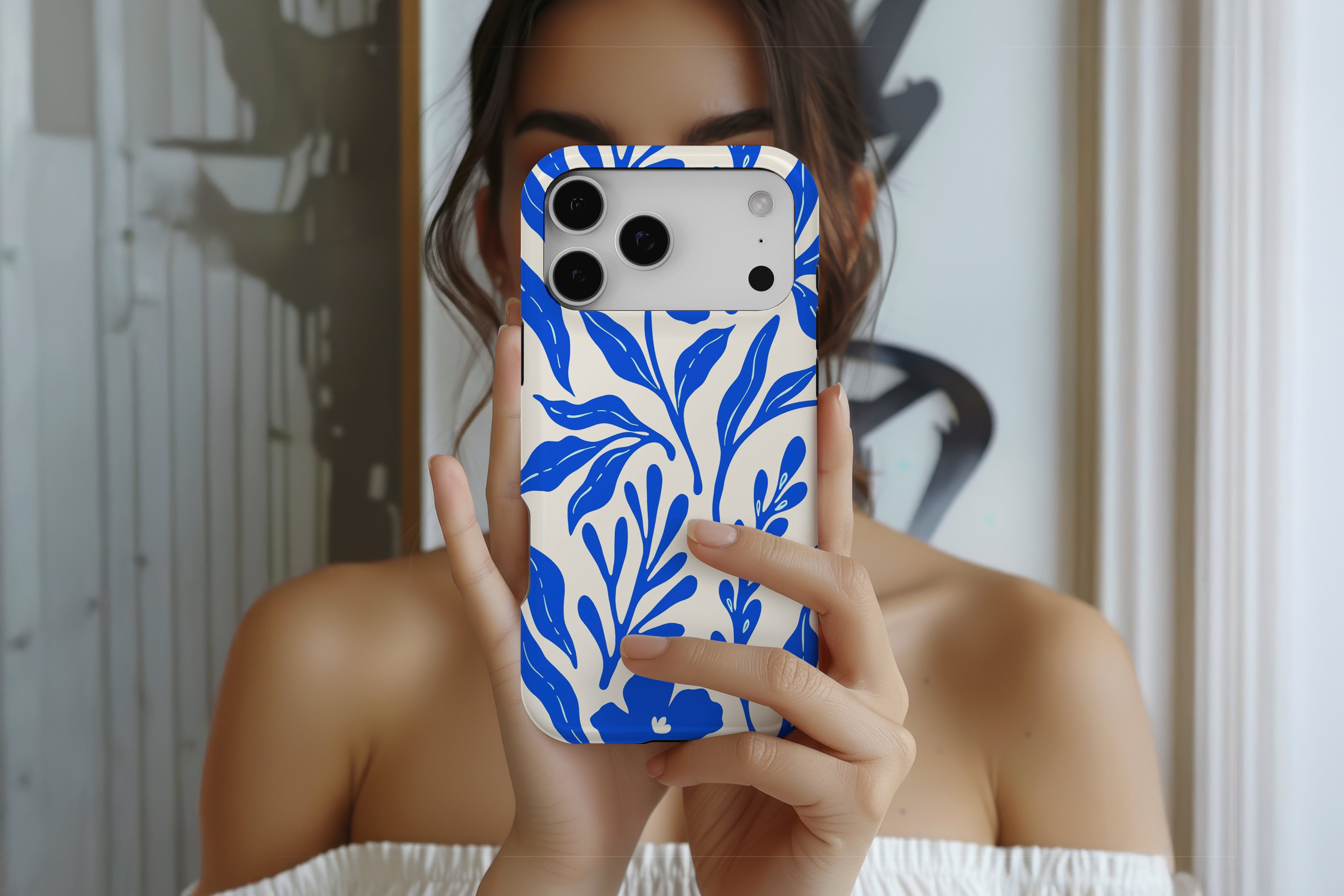 Lifestyle image of Matisse Cobalt magnetic tough case showing cobalt blue floral design 