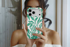 Lifestyle image of Matisse Green magnetic tough case showing green floral design 