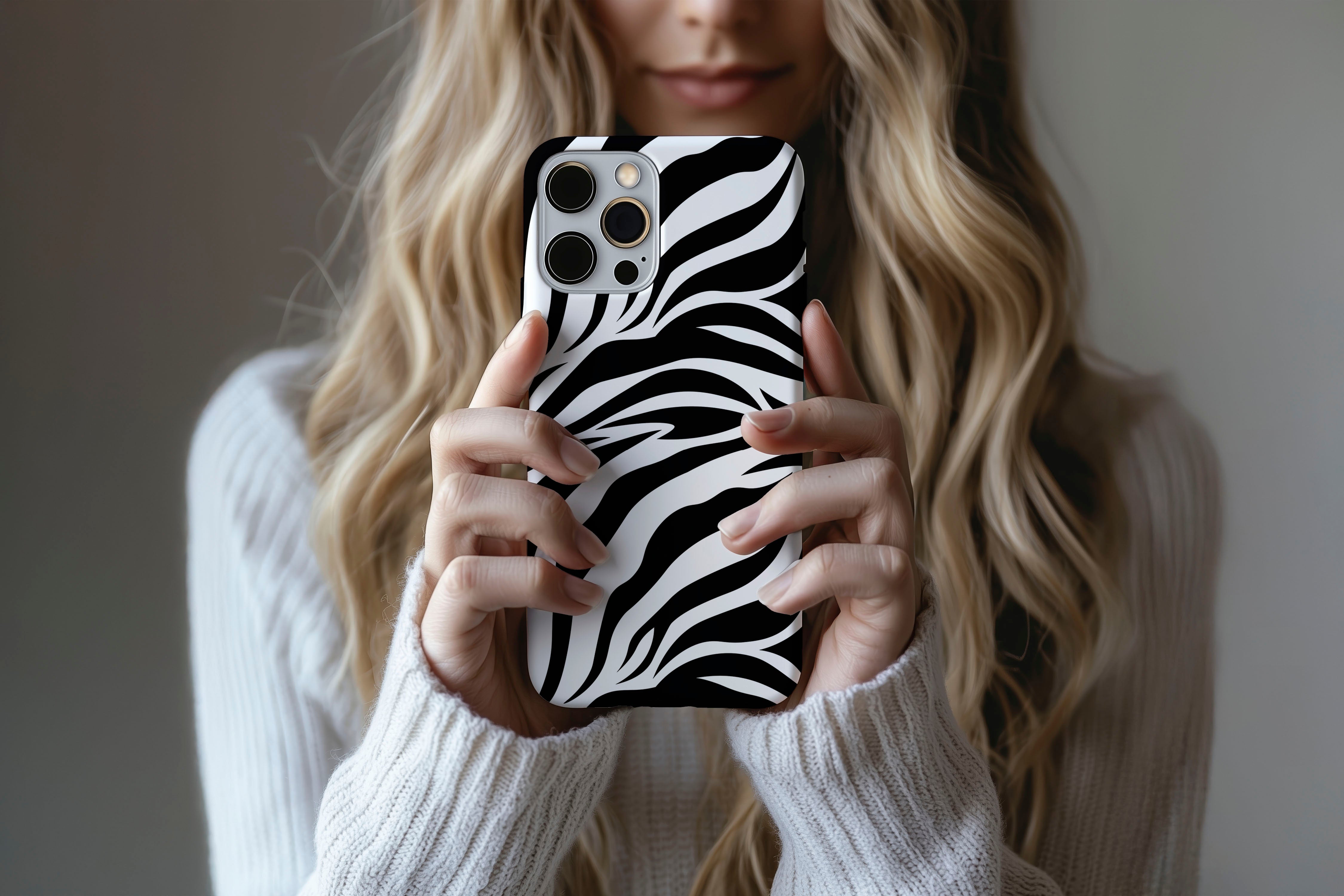 Lifestyle image of Mono Zebra phone case showing zebra print design