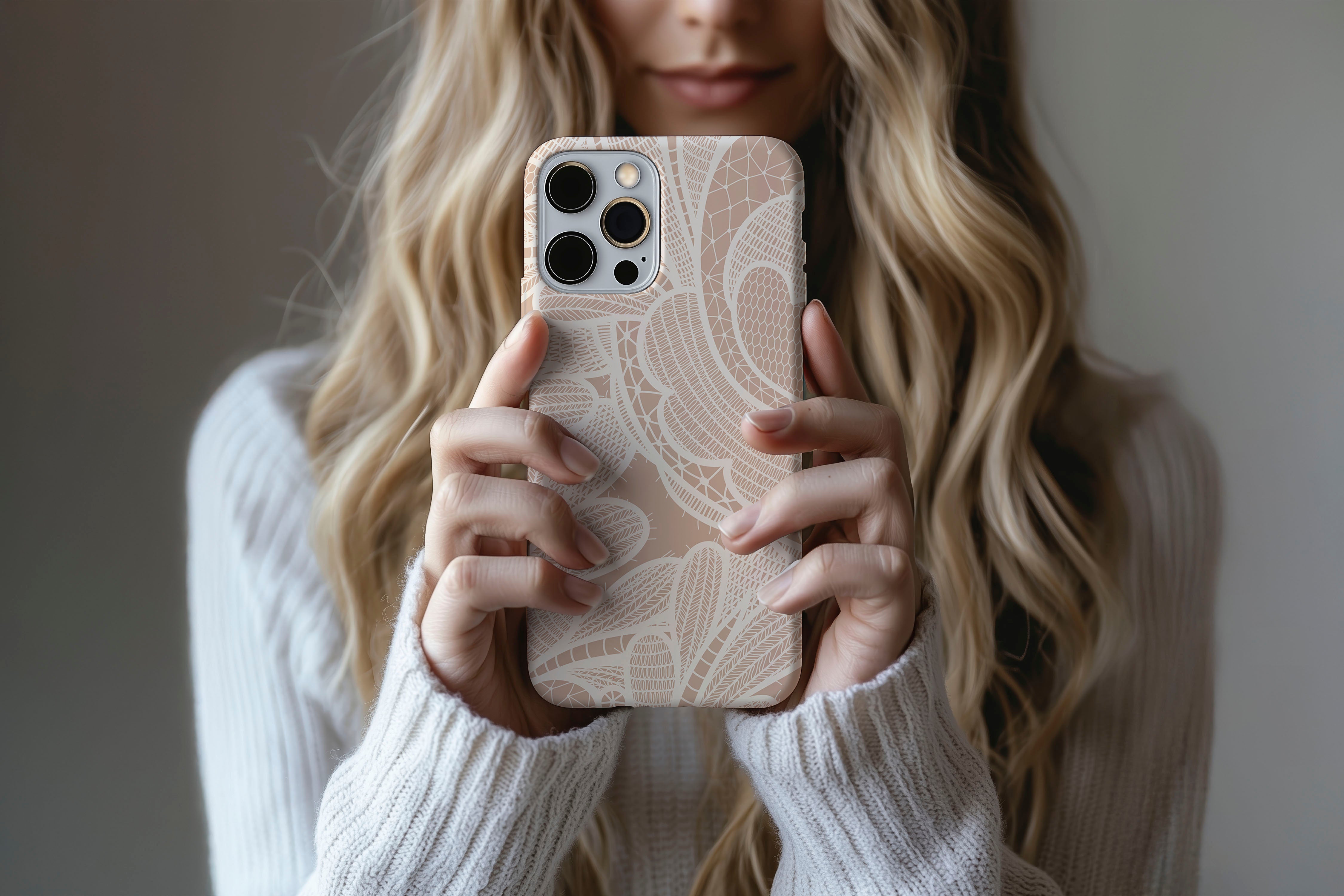 Lifestyle image of Nude Lace phone case showing lace print design 