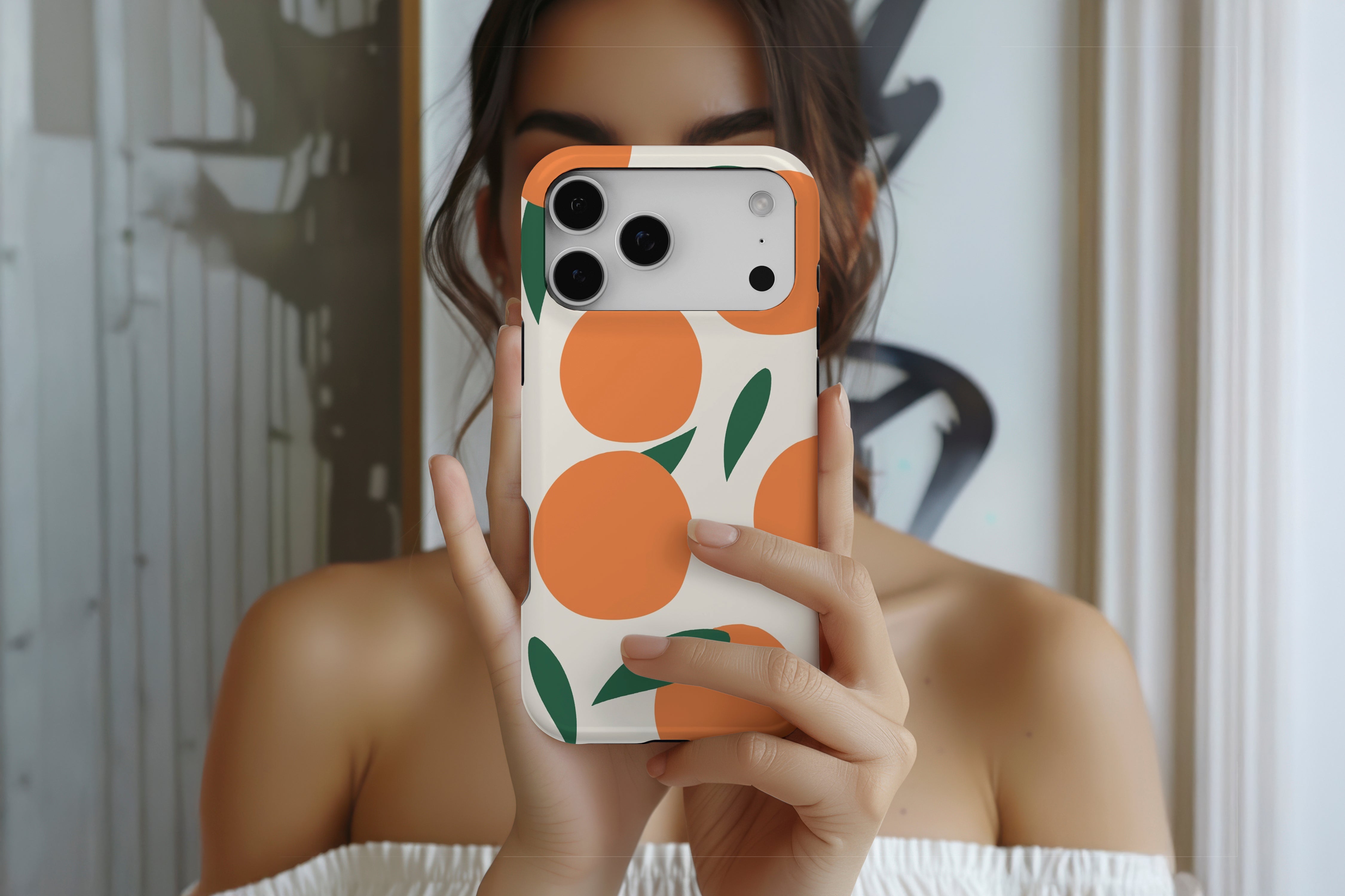 Lifestyle image of Oranges magnetic tough case showing orange fruity design 