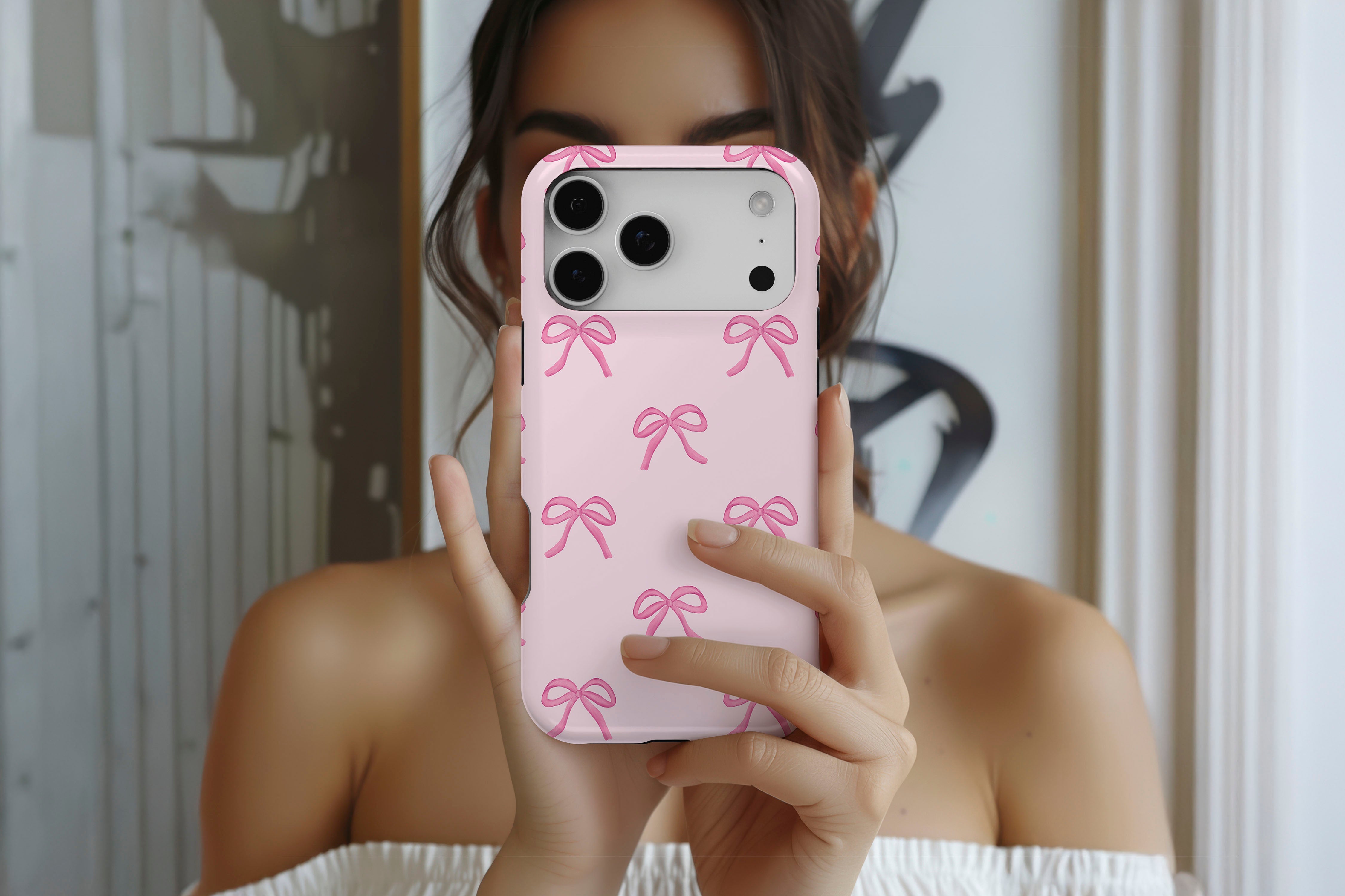 Lifestyle image of Pink Bows magnetic tough case showing pink bow print design 