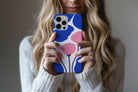 Lifestyle image of Poppy Art phone case showing floral print design