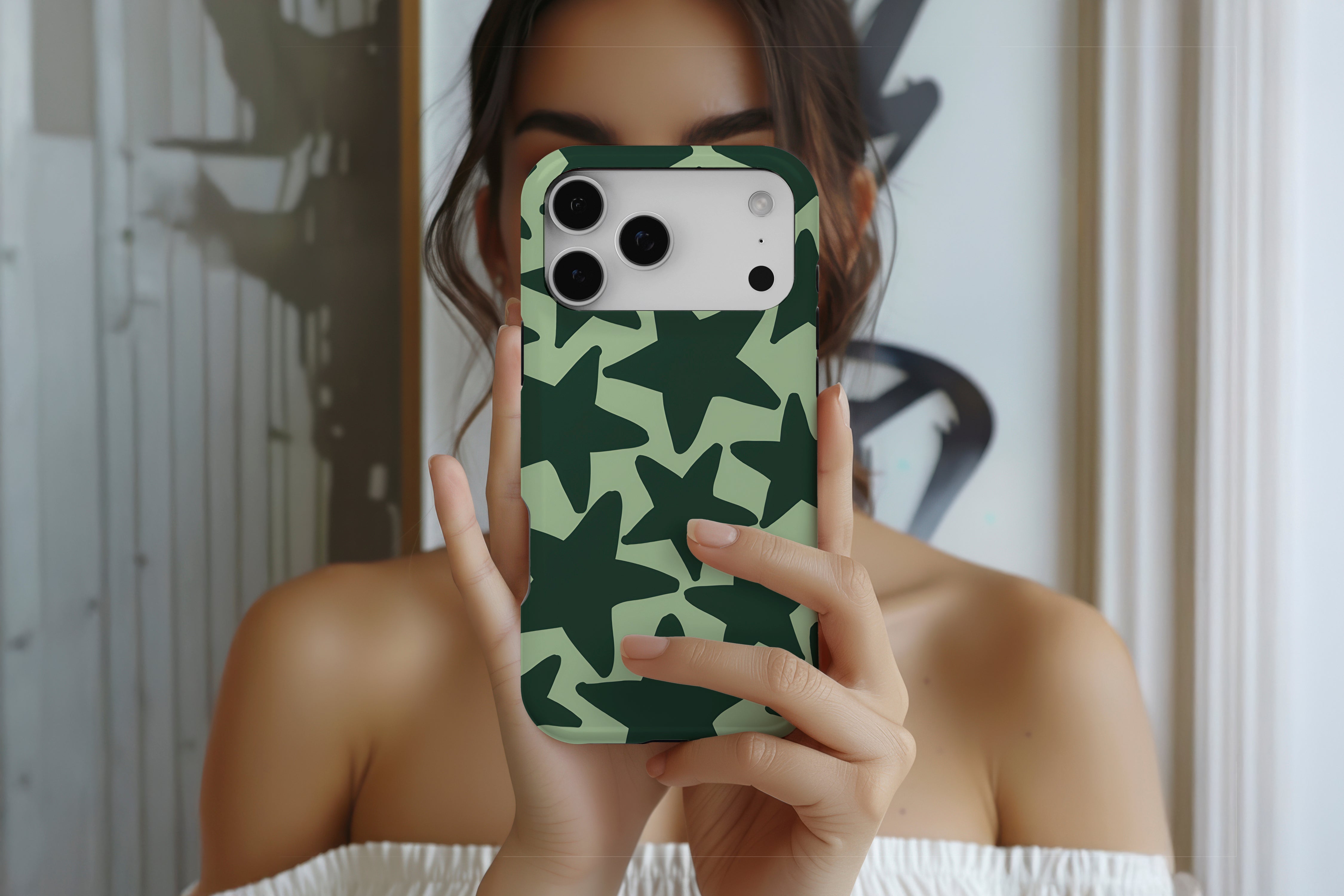 Lifestyle image of Stars Green magnetic tough case showing stars design 