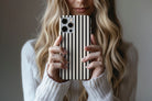 Lifestyle image of Stripes Black phone case showing stipes design 