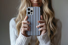 Lifestyle image of Stripes (Blue Mocha) phone case showing stripe print design