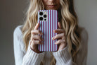 Lifestyle image of Stripes (Burgundy) phone case showing stripe print design