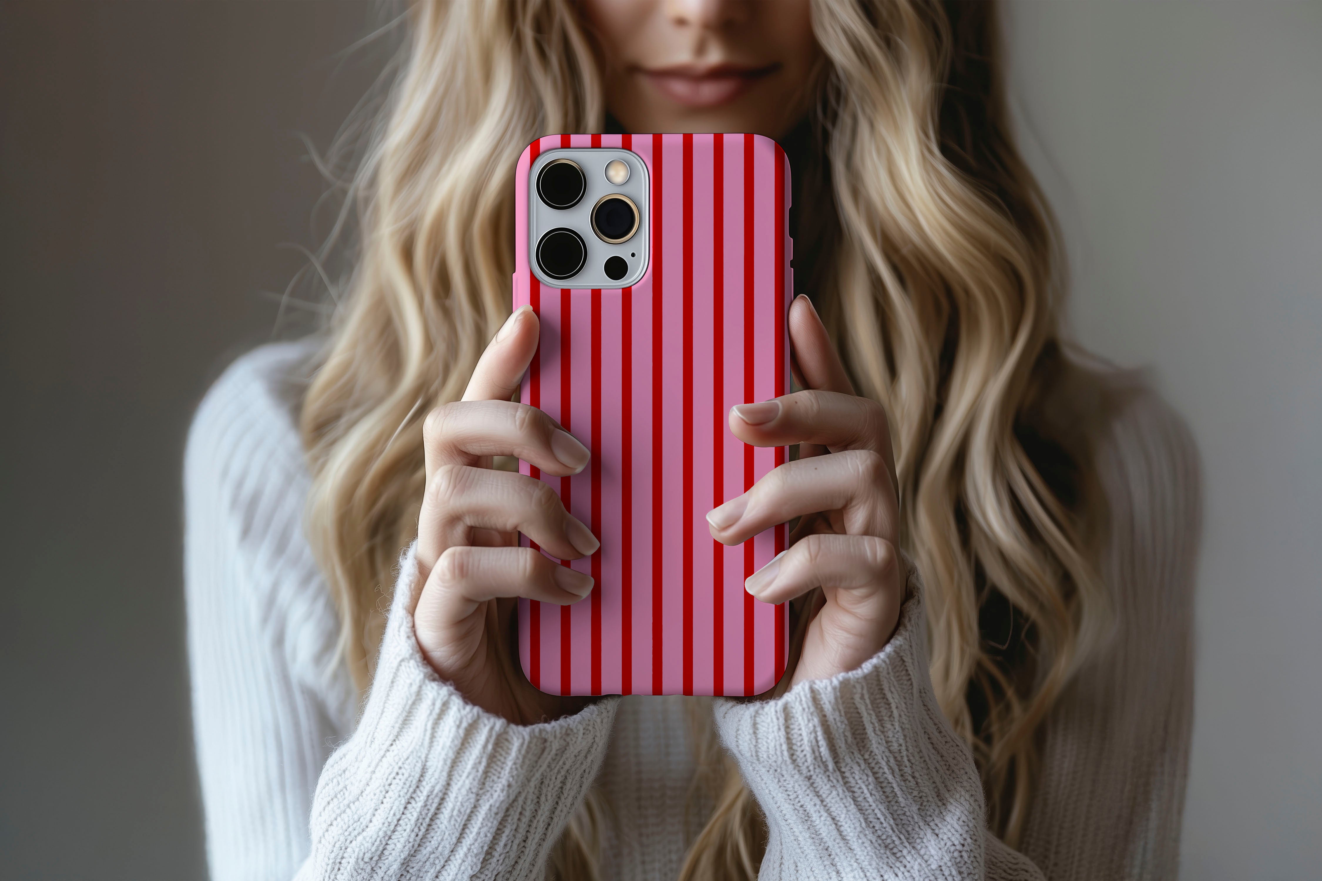 Lifestyle image of Stripes Cherry phone case showing stipes design 