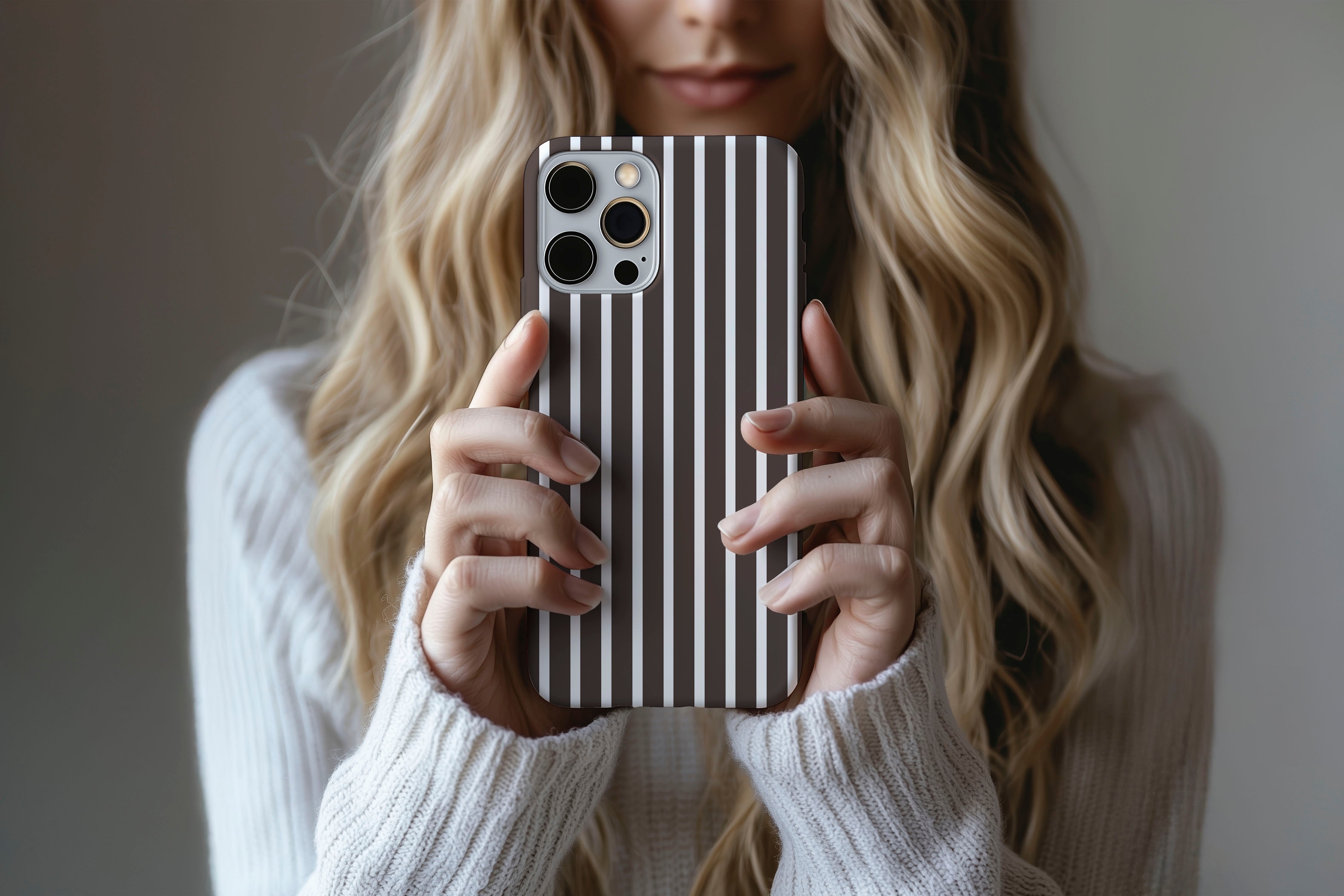 Lifestyle image of Stripes (Chocolate) phone case showing stripe print design