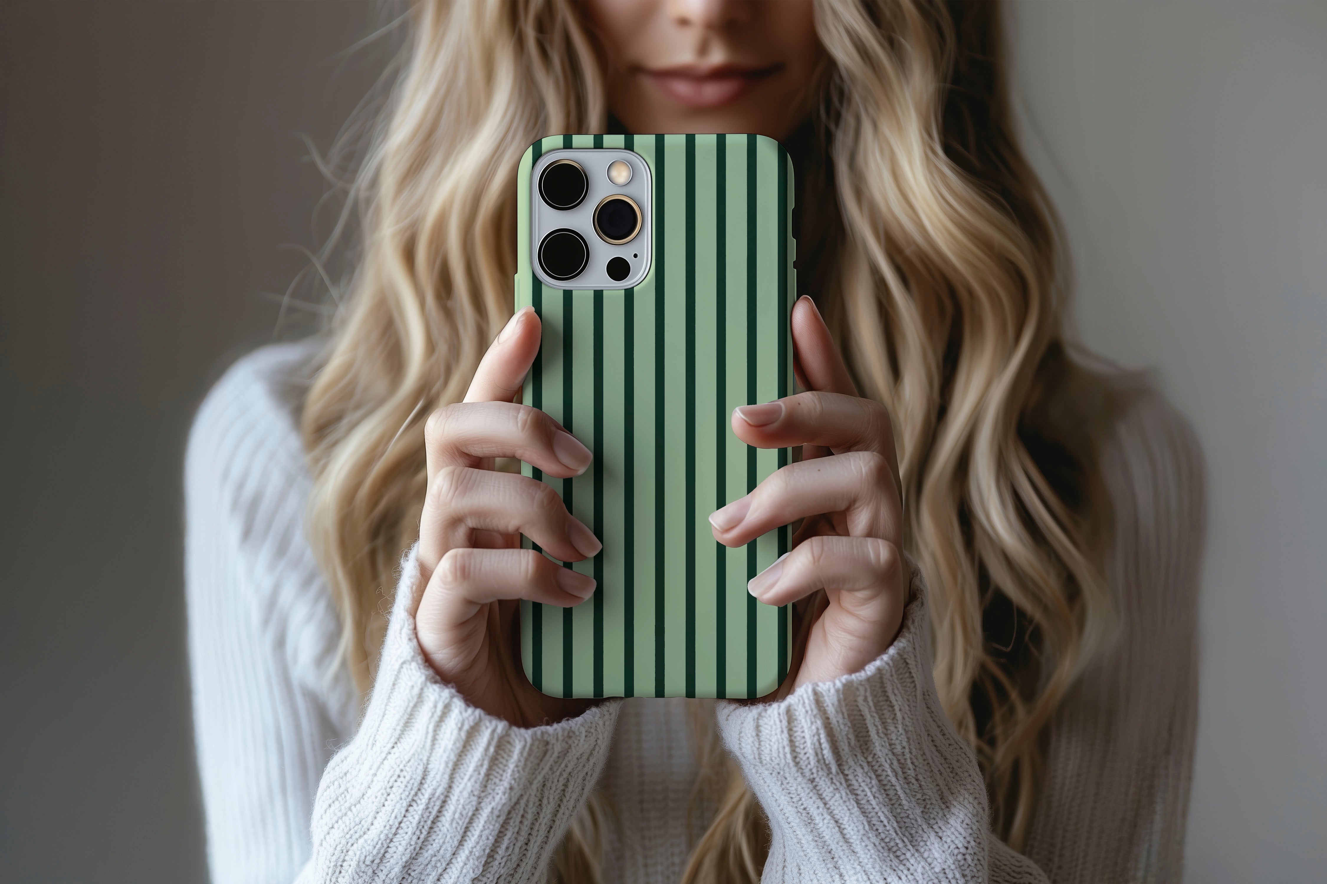 Lifestyle image of Stripes Green phone case showing stipes design 