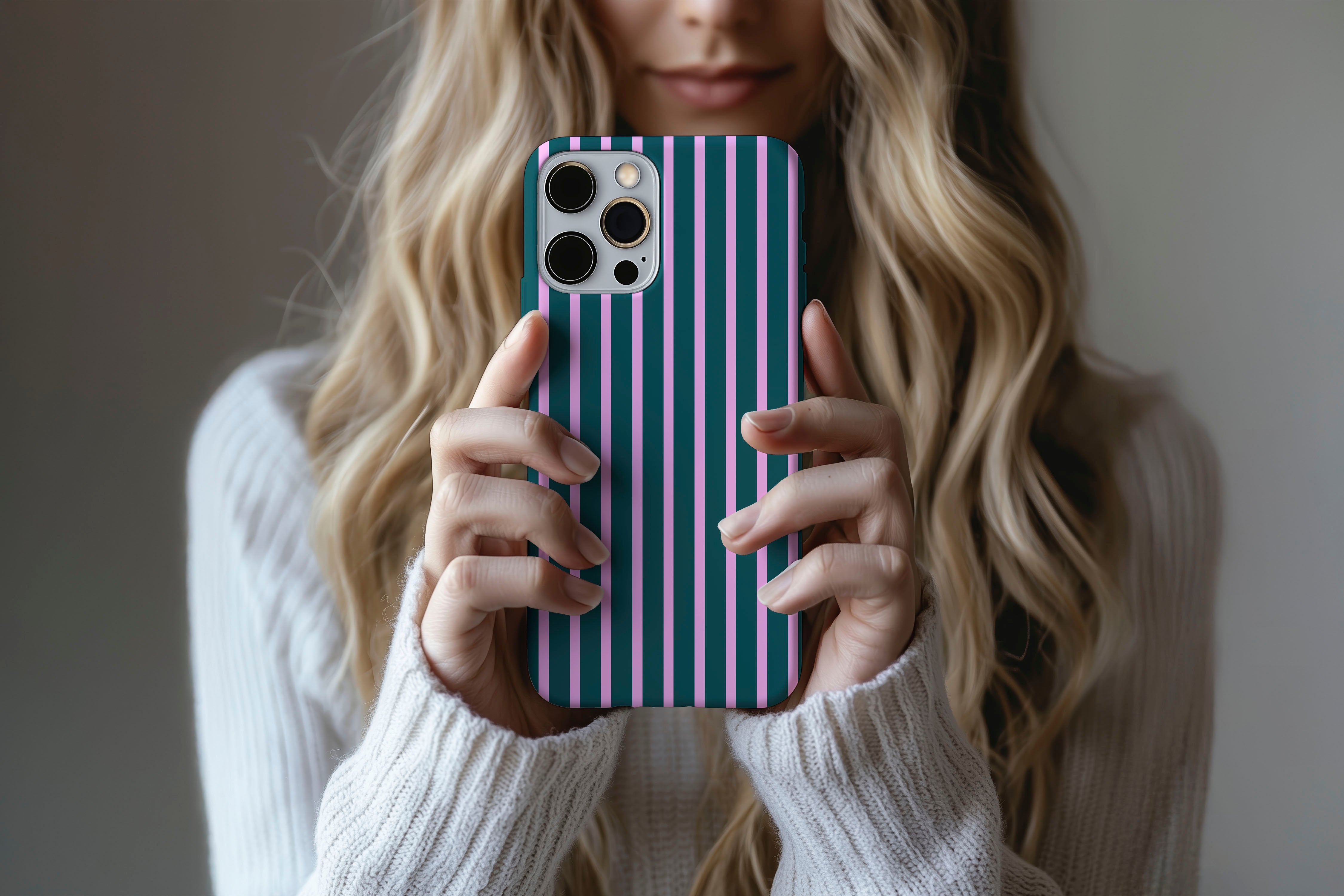 Lifestyle image of Stripes (Ivy) phone case showing stripe print design