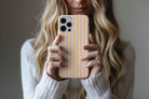 Lifestyle image of Stripes (Lemonade) phone case showing stripe print design