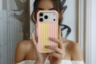 Lifestyle image of Stripes (Lemonade) magnetic tough case showing stripe print design