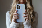 Lifestyle image of Stripes (Neapolitan) phone case showing stripe print design